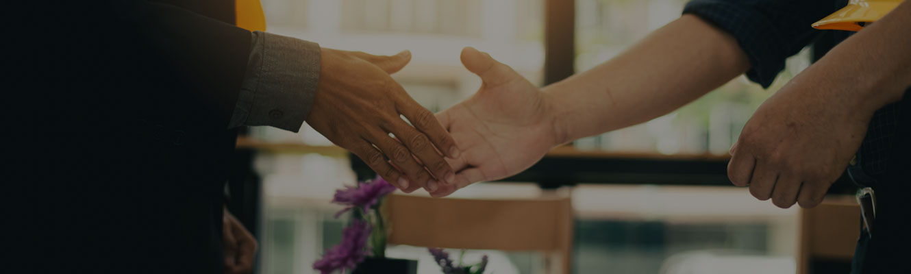 closeup of two hands shaking in a business partnership